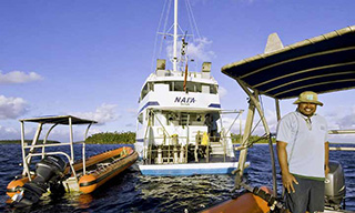 The Nai'a from the stern with its tenders