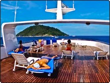 Soaking up the rays on MV Scuba Explorer's very spacious wood panelled sundeck