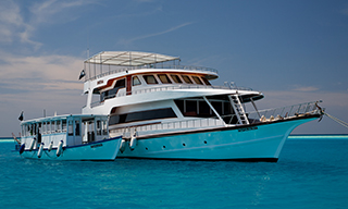 MY Sheena and dhoni at anchor in the Maldives