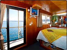 Large glass sliding doors from your cabin take you right onto AS Tui Tai's deck overlooking Taveuni in Fiji