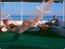 This could be you lazing in the Red Sea in the VIP One dive boat's upper deck hammock